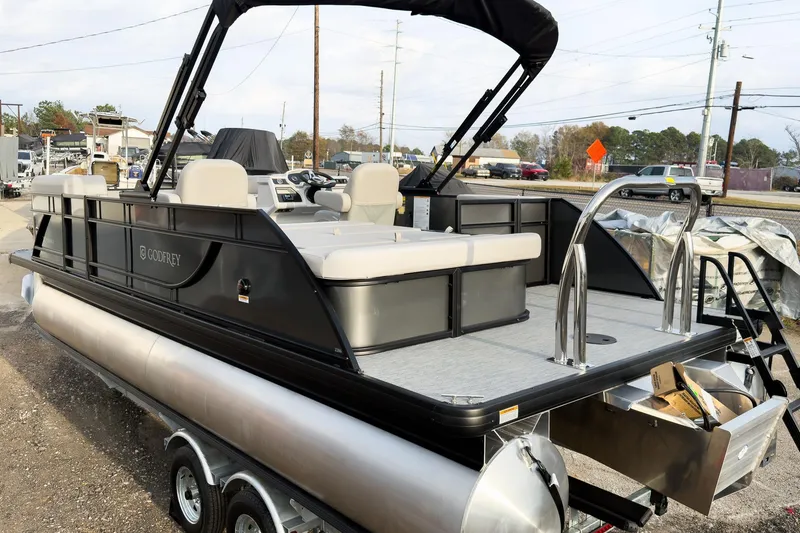 Slide: The Image of 2026 Godfrey Sweetwater Xperience 22' Tritoon with single flip lounge, parked on trailer. - 5