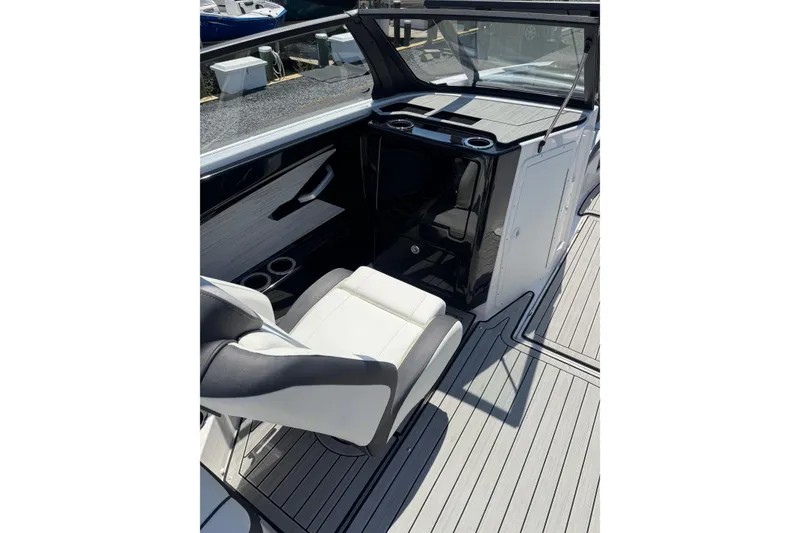 Slide: The Image of 2023 Yamaha Boats 222SD interior with sleek seating and modern dashboard design. - 12