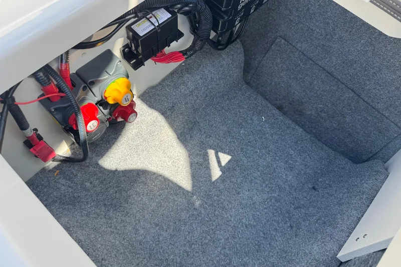 Slide: The Image of Interior of 2023 Yamaha Boats 222SD with electrical connections. - 13