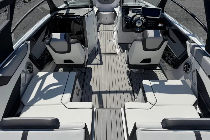 Slide: The Image of 2023 Yamaha Boats 222SD interior with sleek seating and modern dashboard design. - 5
