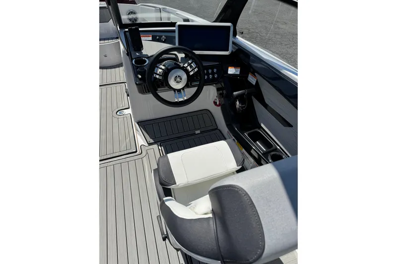 Slide: The Image of 2023 Yamaha Boats 222SD cockpit with steering wheel, touchscreen, and modern controls. - 6