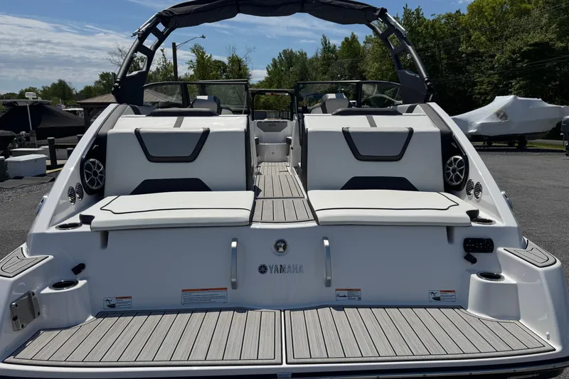 Slide: The Image of 2023 Yamaha Boats 222SD, rear view, showcasing seating and deck design. - 8