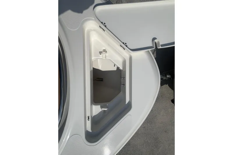 Slide: The Image of Open storage compartment on 2026 Pioneer 222 Islander boat deck. - 21