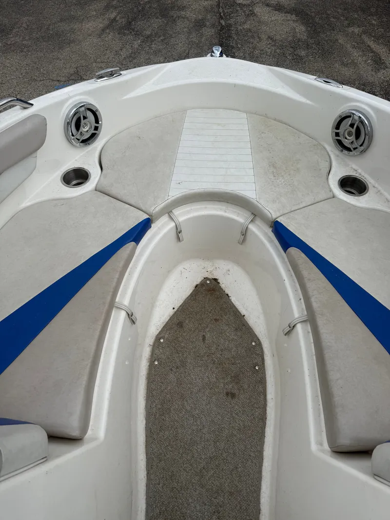 Slide: The Image of Interior view of a 2008 Glastron GT 225 boat with blue accents. - 4