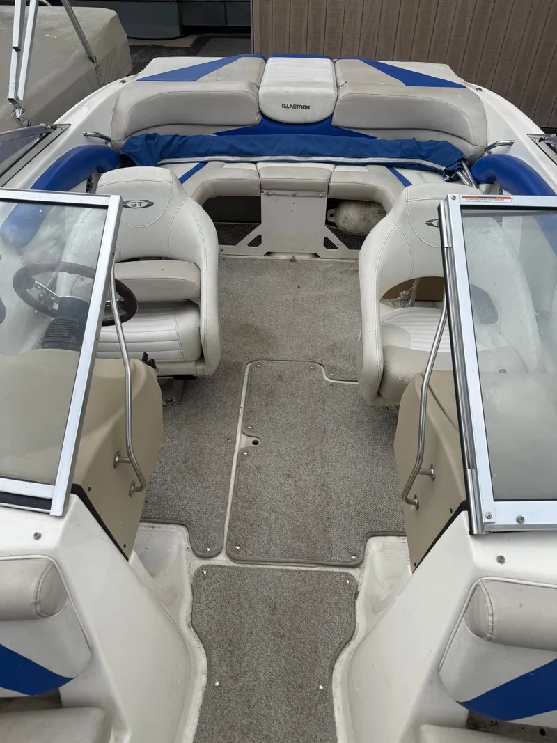 Slide: The Image of Interior of a 2008 Glastron GT 225 boat with seating. - 6