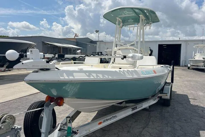 The Image of 2021 Skeeter SX2250 boat on trailer, parked outdoors under a cloudy sky. - 0