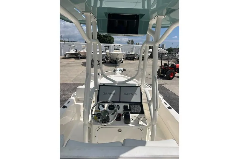 Slide: The Image of 2021 Skeeter SX2250 boat console with Garmin navigation system, parked outdoors. - 11
