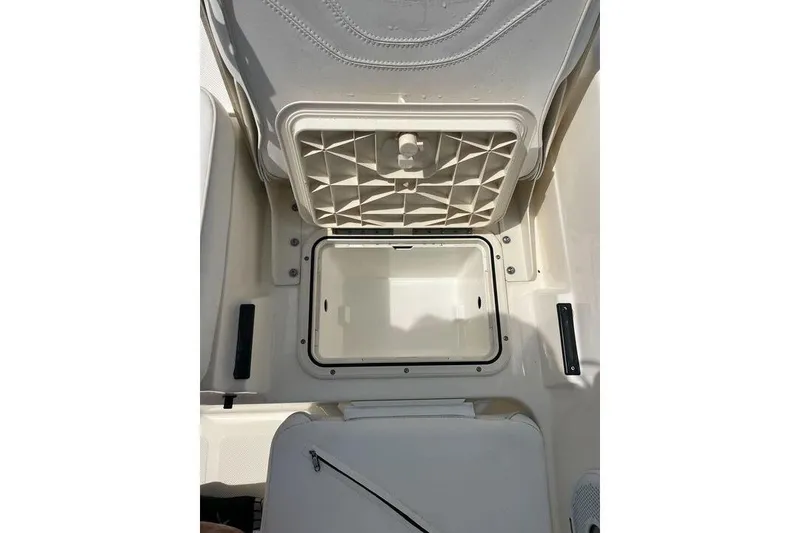 Slide: The Image of Open storage compartment on a 2021 Skeeter SX2250 boat, showcasing interior space. - 18