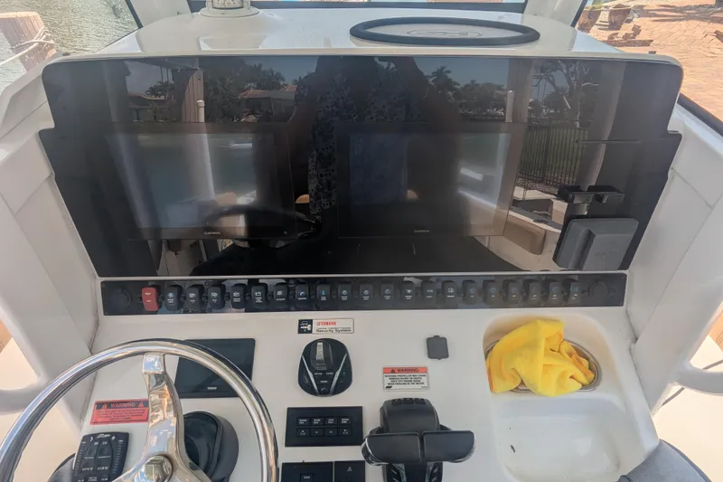 Slide: The Image of 2021 Sea Hunt Gamefish 30 helm with dual Garmin displays and control panel. - 10