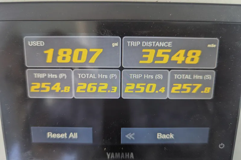 Slide: The Image of Display screen showing fuel usage and trip data for 2021 Sea Hunt Gamefish 30 boat. - 16