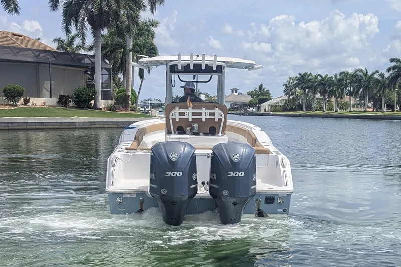 Slide: The Image of 2021 Sea Hunt Gamefish 30 boat with dual Yamaha 300 engines on a scenic waterway. - 4
