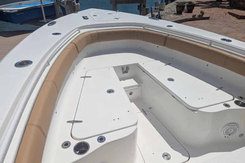 Slide: The Image of 2021 Sea Hunt Gamefish 30 Forward Seating boat with spacious deck and tan cushioned seating. - 7