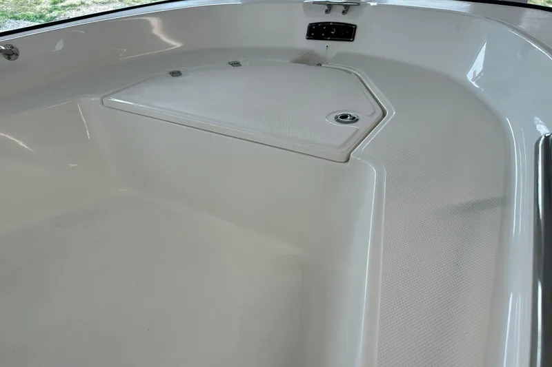 Slide: The Image of 2026 Boston Whaler 150 Montauk boat interior, featuring a sleek, spacious deck design. - 25