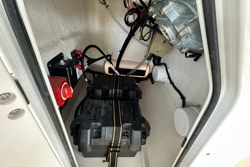 Slide: The Image of 2026 Boston Whaler 150 Montauk interior wiring and battery compartment view. - 28