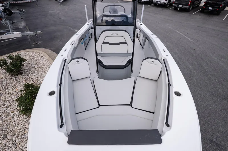 Slide: The Image of 2026 Sea Pro 245FLXR Sandbar boat interior with cushioned seating and sleek design. - 17