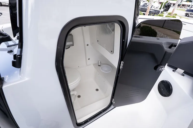 Slide: The Image of Interior view of 2026 Sea Pro 245FLXR Sandbar boat's compact bathroom. - 19