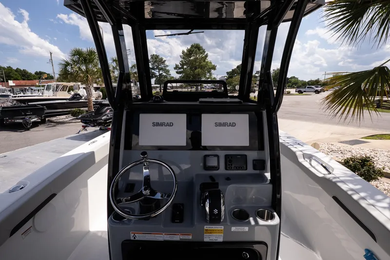 Slide: The Image of 2026 Sea Pro 245FLXR Sandbar boat dashboard with Simrad navigation system. - 7