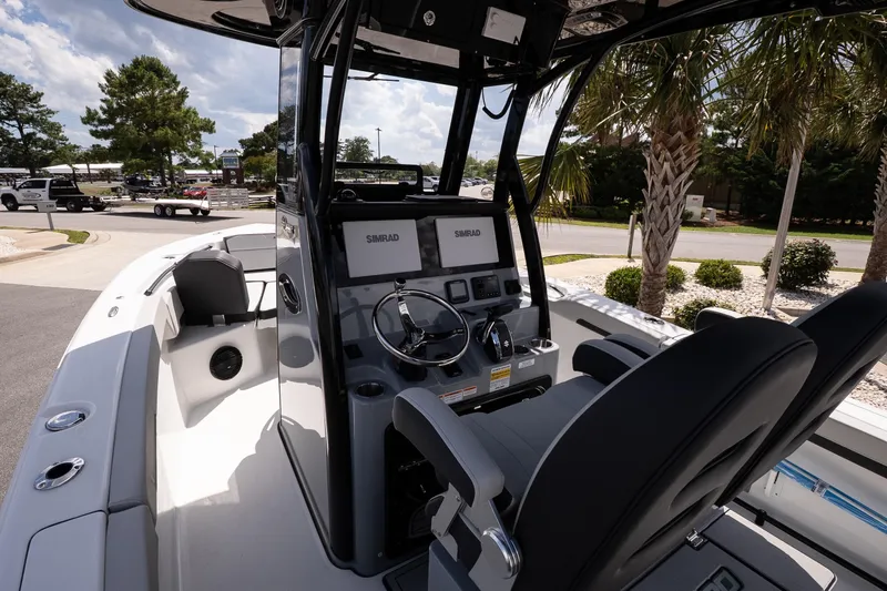 Slide: The Image of 2026 Sea Pro 245FLXR Sandbar boat interior with modern helm and seating. - 8
