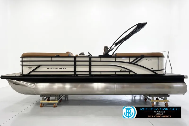 The Image of 2026 Bennington 22 SSR pontoon boat with sleek design and tan seating on display. - 1