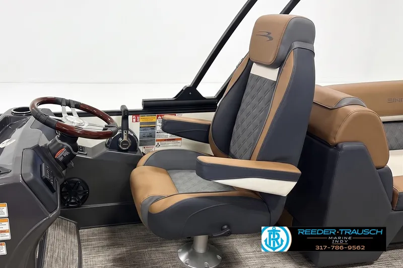 Slide: The Image of 2026 Bennington 22 SSR boat interior with luxury captain's chair and steering wheel. - 3