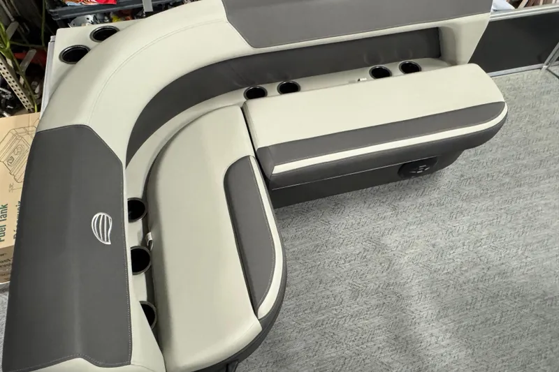 Slide: The Image of 2026 Sun Tracker Bass Buggy 16 XL Select boat seating with cup holders, gray upholstery. - 14