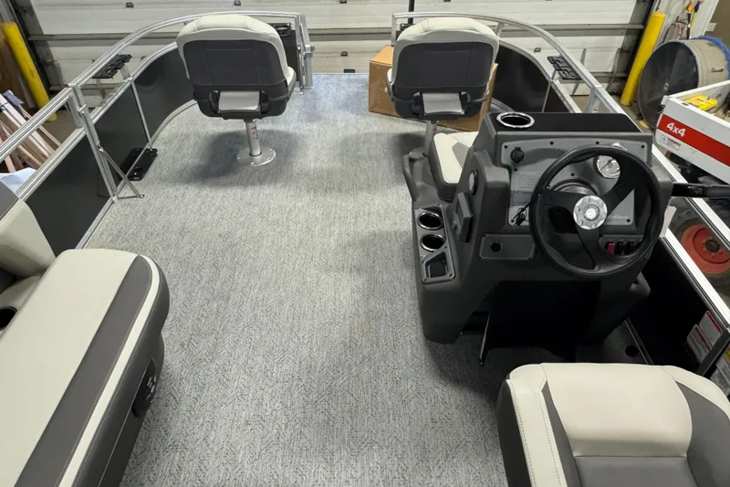 Slide: The Image of 2026 Sun Tracker Bass Buggy 16 XL Select interior with steering console and seating. - 15