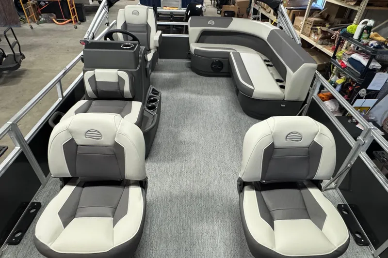 Slide: The Image of 2026 Sun Tracker Bass Buggy 16 XL Select pontoon boat interior with plush seating. - 6
