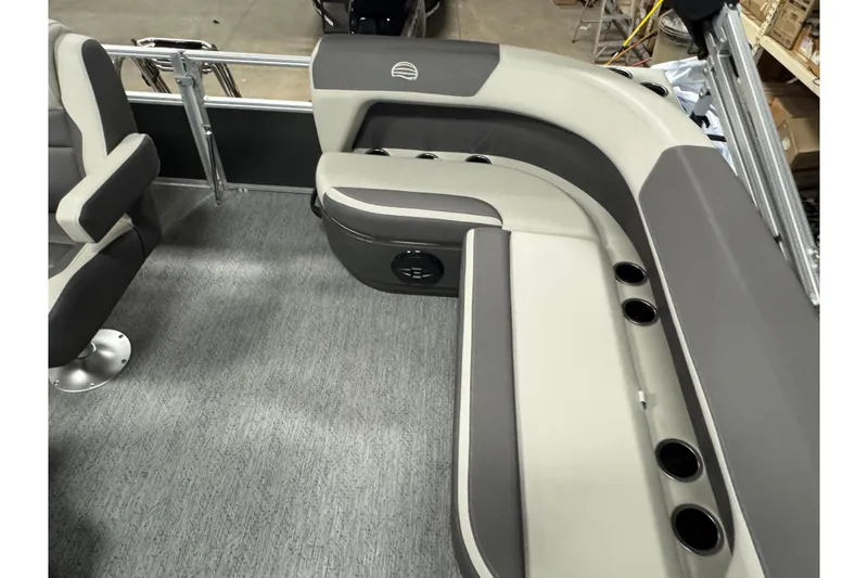 Slide: The Image of 2026 Sun Tracker Bass Buggy 16 XL Select interior seating with cup holders and gray upholstery. - 8