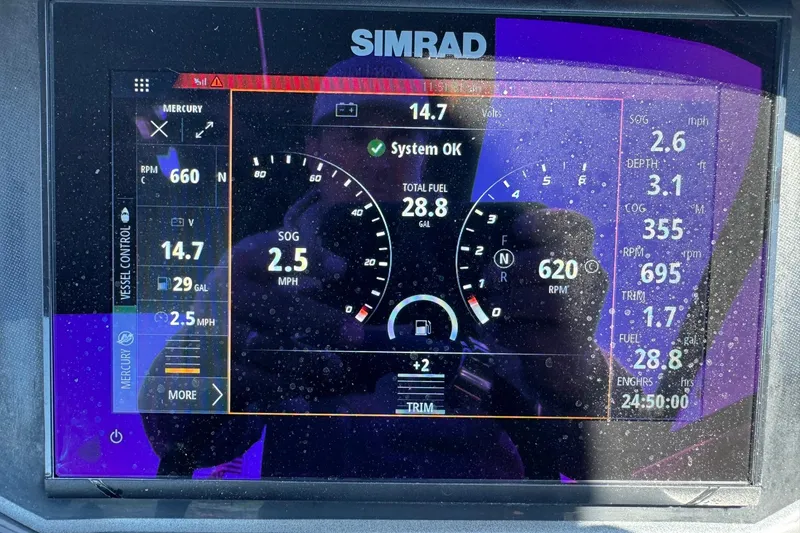 Slide: The Image of Simrad display showing 2024 Bayliner VR6 Bowrider OB engine data and navigation metrics. - 12