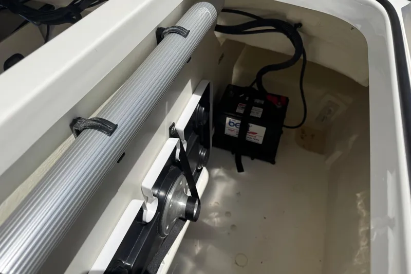 Slide: The Image of 2024 Bayliner VR6 Bowrider OB interior showing battery compartment and storage area. - 20