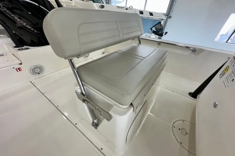Slide: The Image of 2026 Boston Whaler 190 Montauk boat interior with cushioned seating and sleek design. - 22