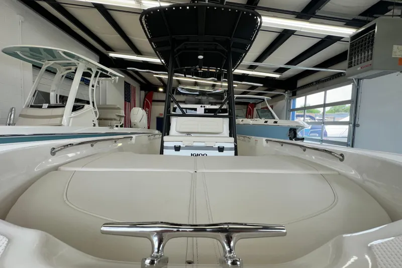 Slide: The Image of 2026 Boston Whaler 190 Montauk boat interior in showroom, showcasing sleek design and modern features. - 26