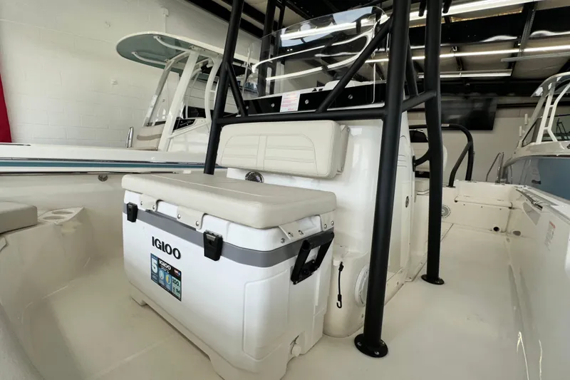 Slide: The Image of 2026 Boston Whaler 190 Montauk boat interior with Igloo cooler and seating. - 28