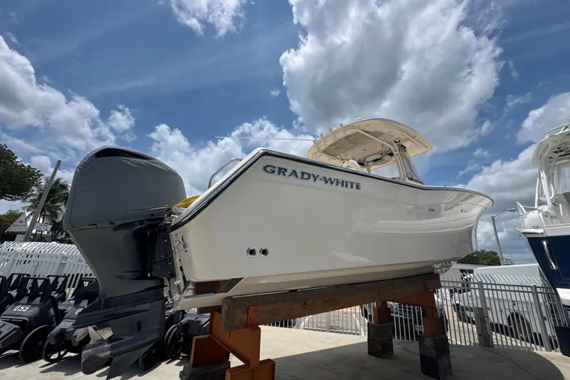 The Image of 2017 Grady-White Canyon 306 boat displayed outdoors under a cloudy sky. - 0