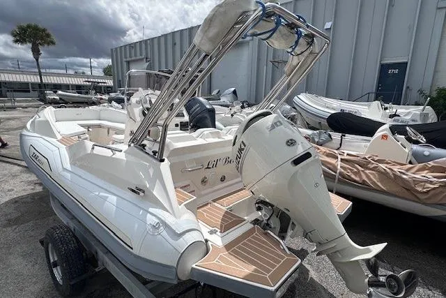 The Image of 2017 Zar Formenti 49 SL boat with outboard motor, docked outdoors. - 1