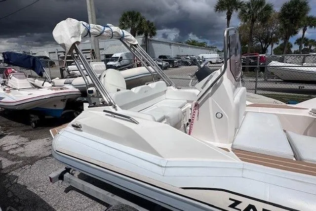 Slide: The Image of 2017 Zar Formenti 49 SL boat with sleek design, parked outdoors under cloudy skies. - 3