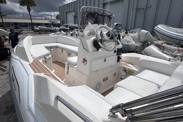 Slide: The Image of 2017 Zar Formenti 49 SL boat with sleek white interior and modern steering console. - 4