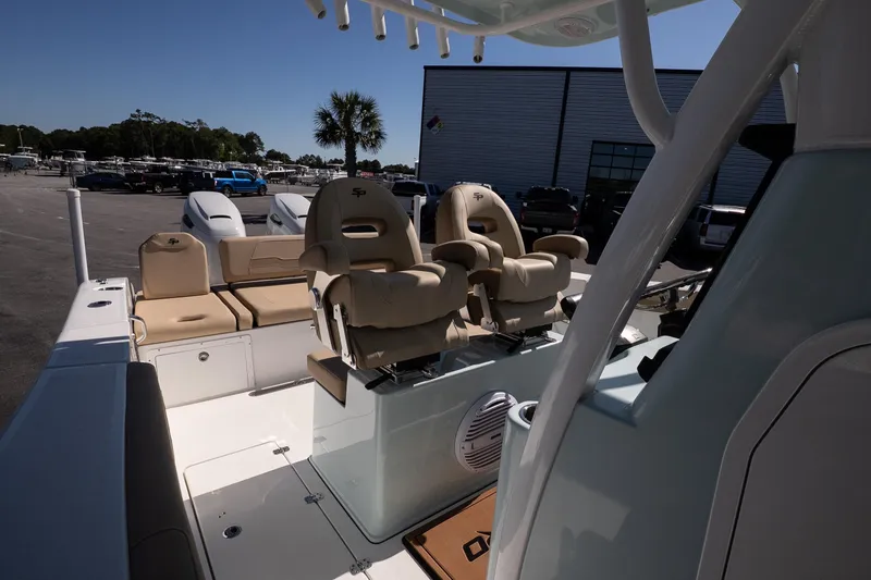 Slide: The Image of 2026 Sea Pro 265FLX Sandbar boat interior with plush seating and modern design. - 11