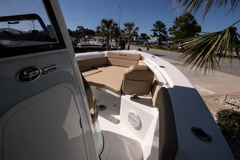 Slide: The Image of 2026 Sea Pro 265FLX Sandbar boat with tan seating and sleek design. - 16
