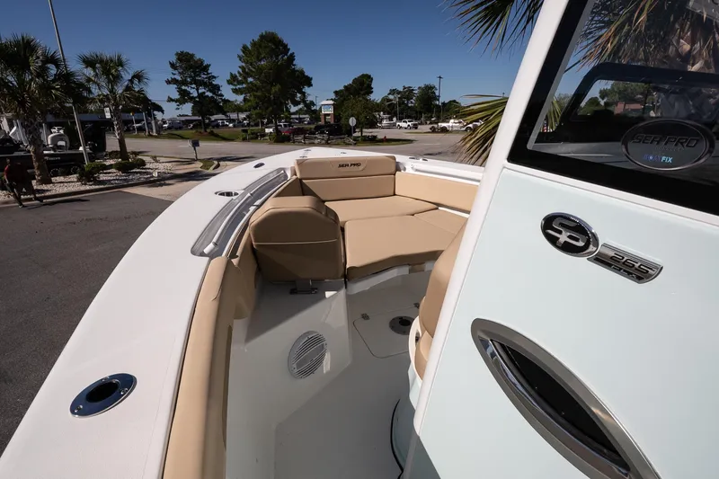 Slide: The Image of 2026 Sea Pro 265FLX Sandbar boat interior with tan seating and sleek design. - 17