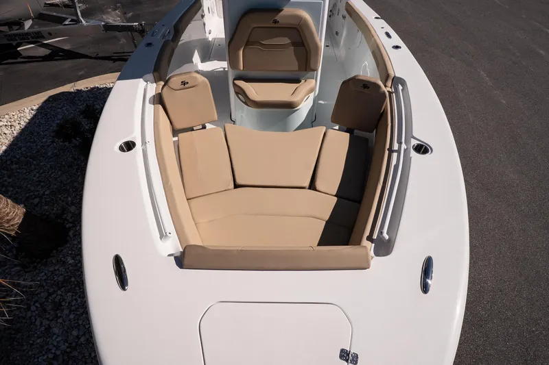 Slide: The Image of 2026 Sea Pro 265FLX Sandbar boat with tan seating and sleek white deck design. - 18