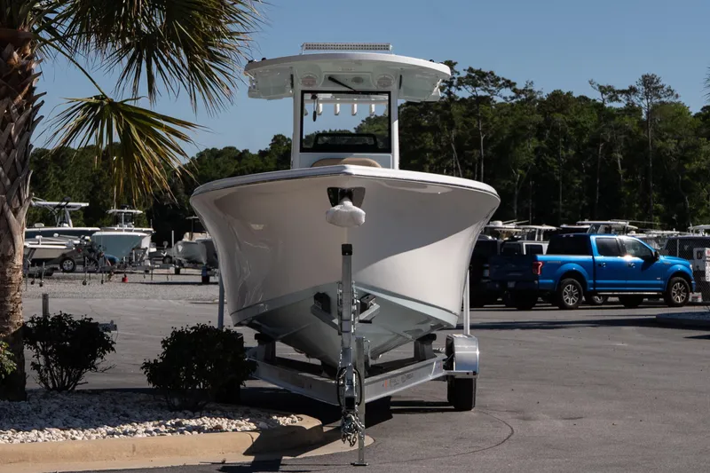Slide: The Image of 2026 Sea Pro 265FLX Sandbar boat on trailer in sunny marina setting. - 3