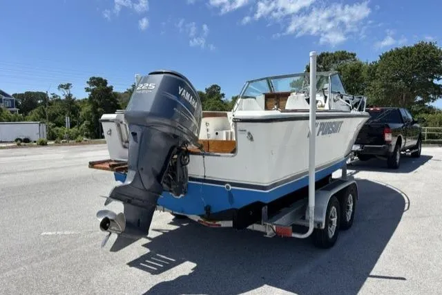 Slide: The Image of 1989 Pursuit 2260 Denali boat on trailer with Yamaha outboard motor. - 21