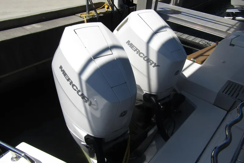 Slide: The Image of Twin Mercury outboard engines on a 2024 Nimbus Commuter 11 boat. - 17