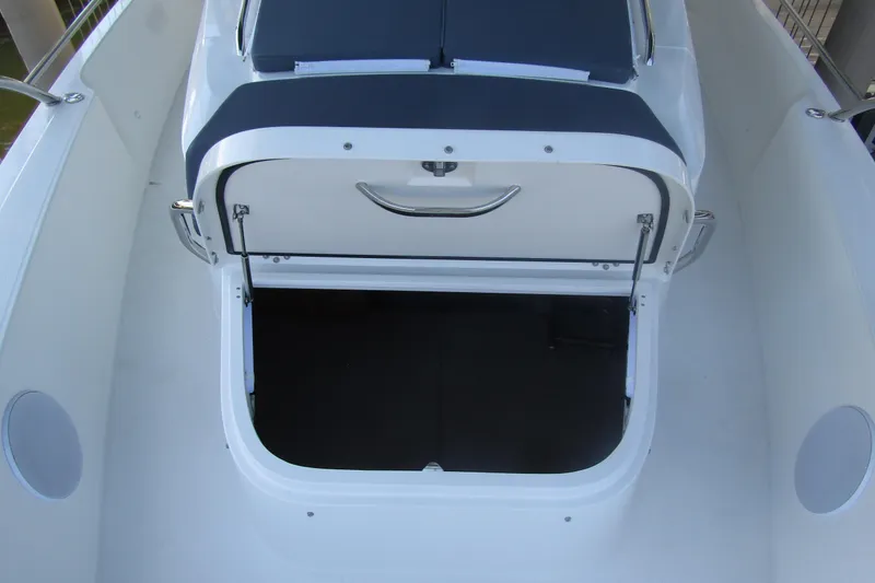 Slide: The Image of 2024 Nimbus Commuter 11 boat storage compartment with open hatch. - 22