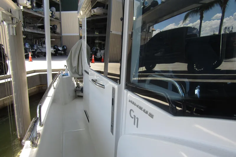 Slide: The Image of 2024 Nimbus Commuter 11 boat docked, showcasing sleek design and modern features. - 30