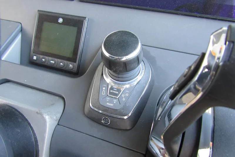 Slide: The Image of Control panel of 2024 Nimbus Commuter 11 featuring joystick and digital display. - 35