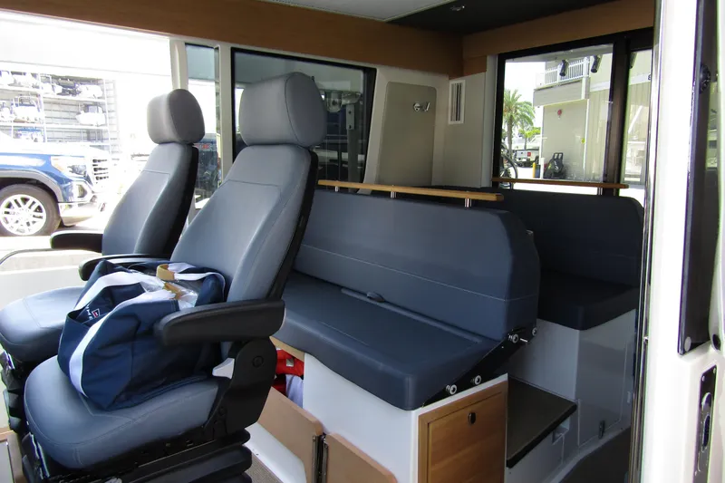 Slide: The Image of 2024 Nimbus Commuter 11 interior with blue seating and modern design. - 37