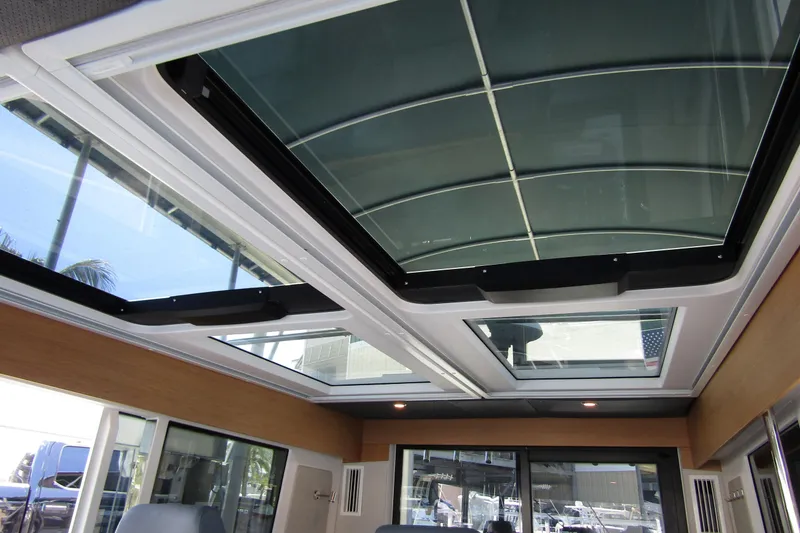 Slide: The Image of 2024 Nimbus Commuter 11 interior with panoramic glass roof and modern design. - 39