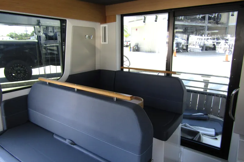 Slide: The Image of 2024 Nimbus Commuter 11 interior with modern seating and large windows. - 43